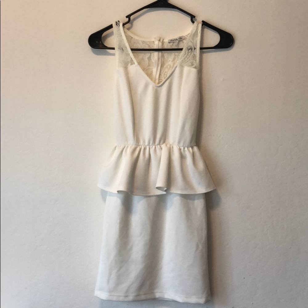 White peplum dress with lace detailing on top